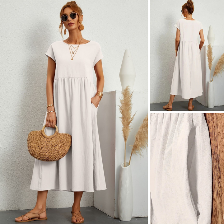 Stylish women's maxi dress with practical pockets, round neck, and a comfortable loose fit for any occasion.
