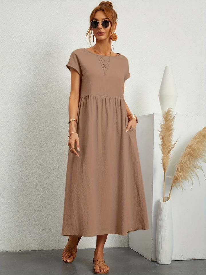 Round neck short sleeve maxi dress for women, offering a comfortable loose fit and practical pockets.