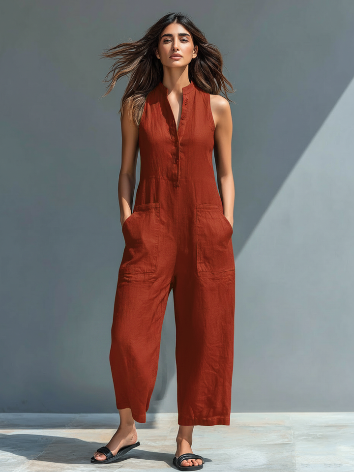 Fashionable women's straight leg jumpsuit with practical button front and side pockets.