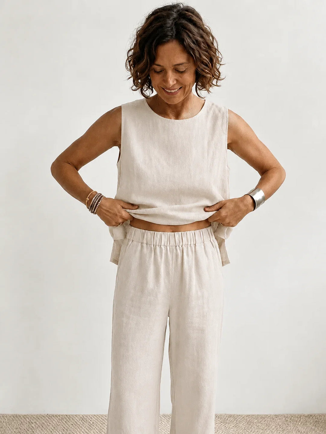 Close-up: sleeveless top from women's two-piece set, soft fabric, relaxed fit, perfect for summer wear.