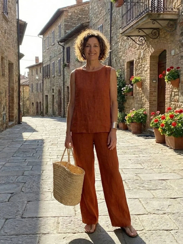Front view: women's two-piece outfit: elegant sleeveless top & wide-leg pants, versatile spring/summer style.