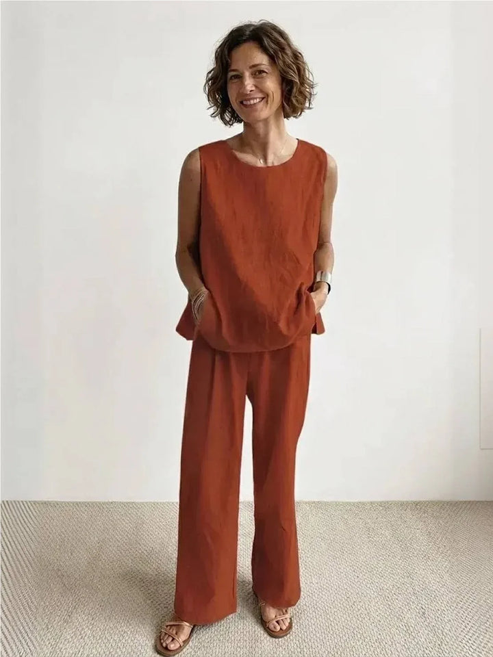 Woman walking in a versatile two-piece sleeveless top and wide-leg pants set, stylish casual summer outfit.
