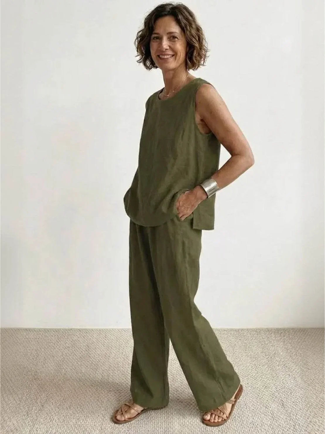 Black women's elegant two-piece set, sleeveless top & wide-leg pants, comfortable and stylish spring fashion.