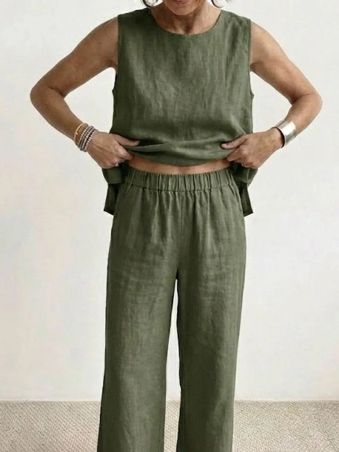 Flowy fabric women's two-piece set with sleeveless top & wide-leg pants, comfortable spring outfit, relaxed look.