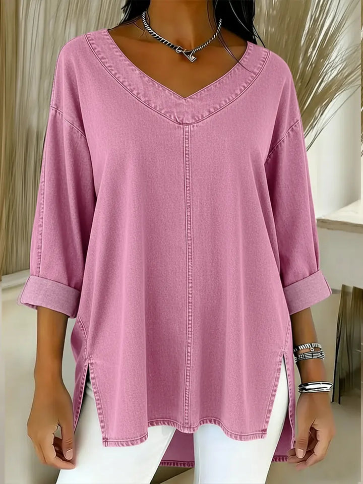 Relaxed fit women's v-neck denim shirt, long sleeve for comfortable casual style. Effortless tunic top for daily wear.