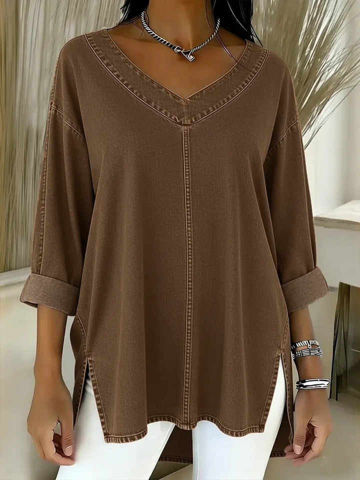 Stylish women's v-neck denim shirt, long sleeve, in a comfortable relaxed fit. Perfect casual blue denim top for women.