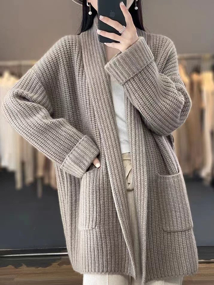 Soft knit v-neck cardigan for women, a comfortable, oversized loose fit sweater for fall and winter casual wear.