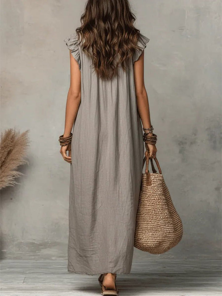 Women's effortless V-neck maxi dress, a perfect relaxed fit vacation dress with chic flutter sleeves.