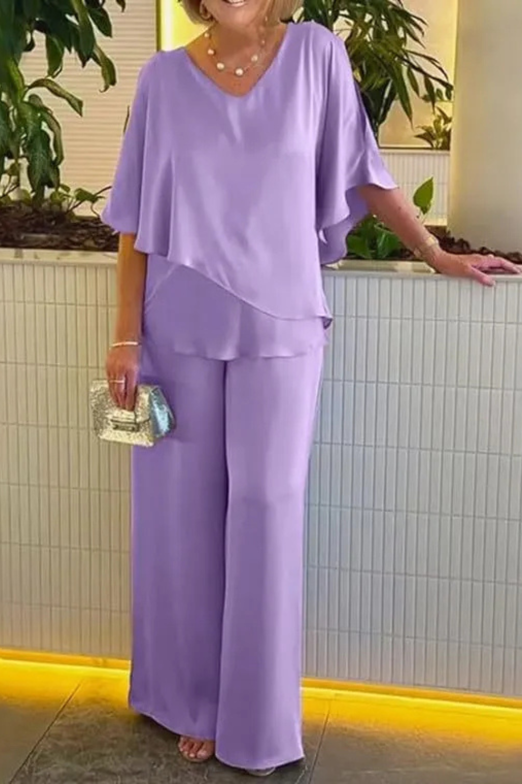 Relaxed fit women's two-piece set with flowy wide leg pants and a comfortable batwing top.