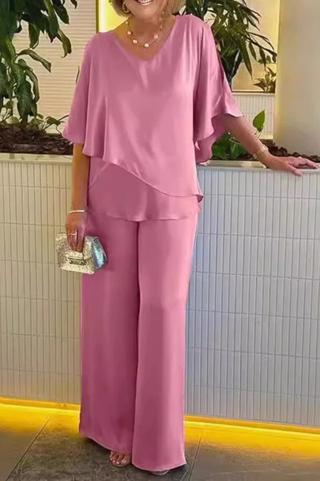 Comfortable women's wide leg pants and relaxed batwing top set, perfect for casual elegance.