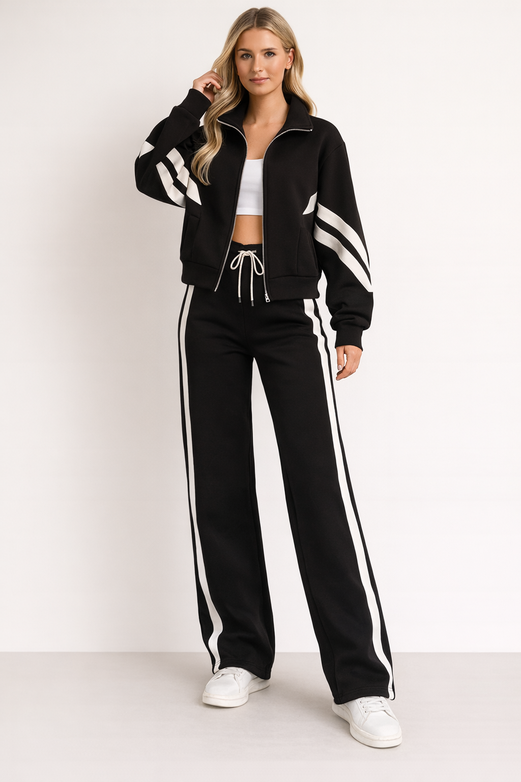 Soft women's two-piece wide leg tracksuit with a front zip jacket, ideal for casual wear, loungewear, and sporty comfort.