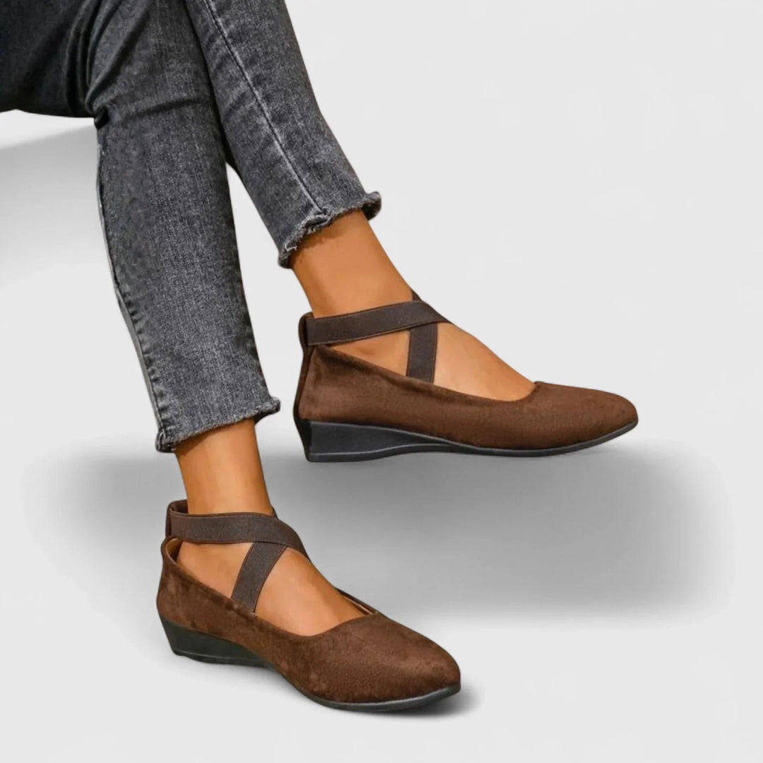 Stylish women's Mary Jane wedge flats with elastic cross-straps and a chic pointed toe, versatile for various outfits.