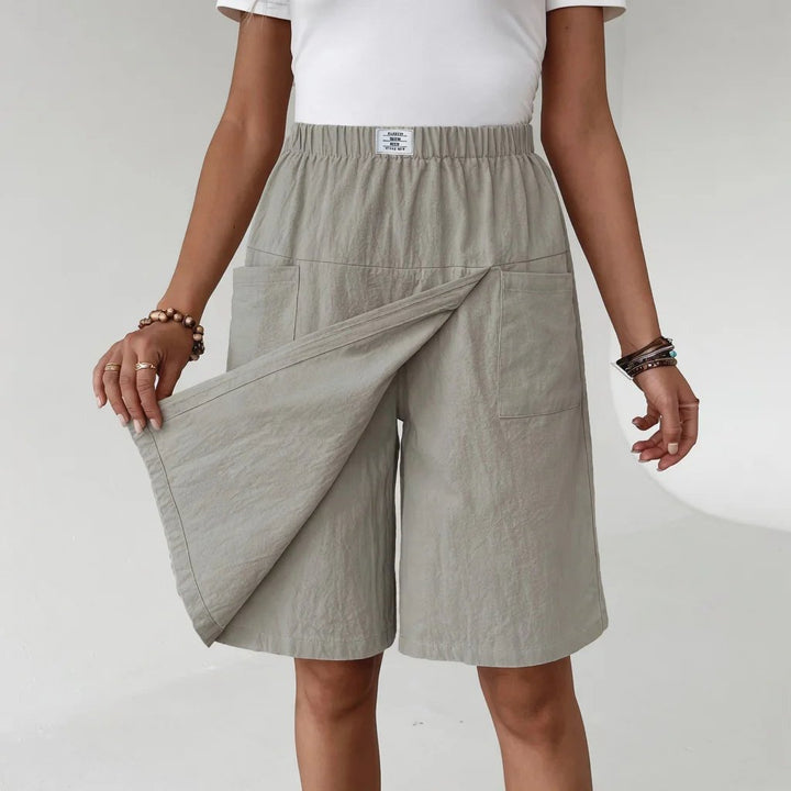 Women's elastic waist active shorts with convenient side pockets, ideal for workouts, running, or casual wear.