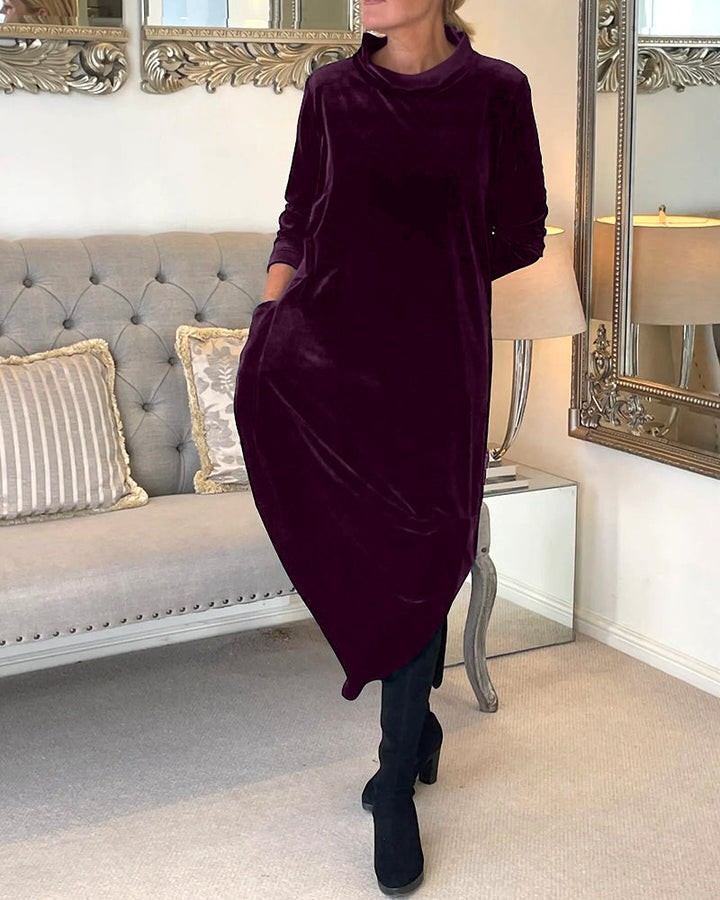 Feminine A-line dress with long sleeves and useful pockets, ideal for a chic, comfy style.