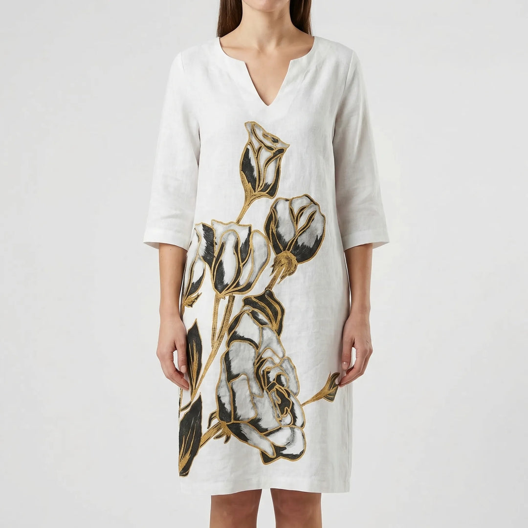 Comfortable long sleeve women's shift dress with a chic abstract floral print. Versatile daytime fashion.