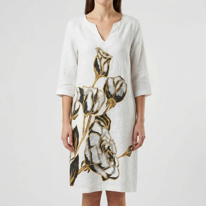 Comfortable long sleeve women's shift dress with a chic abstract floral print. Versatile daytime fashion.