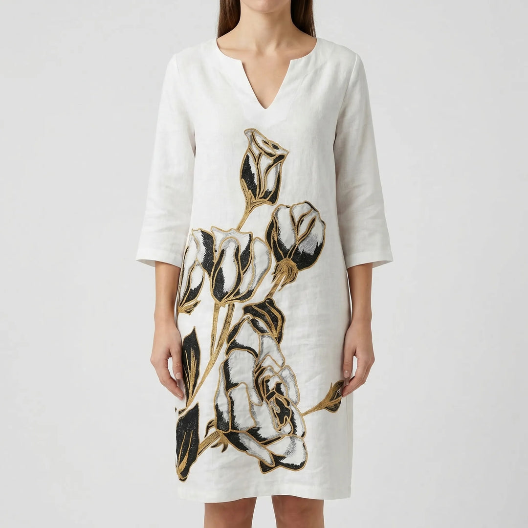 Women's casual long sleeve shift dress with a vibrant abstract floral design. V-neck style.