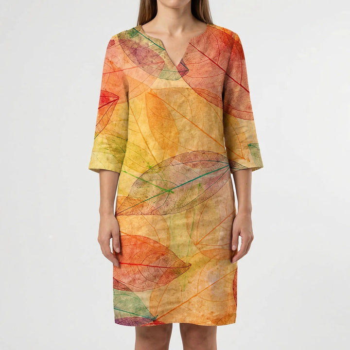 Chic women's long sleeve v-neck shift dress. Features an abstract floral print, perfect for comfort.