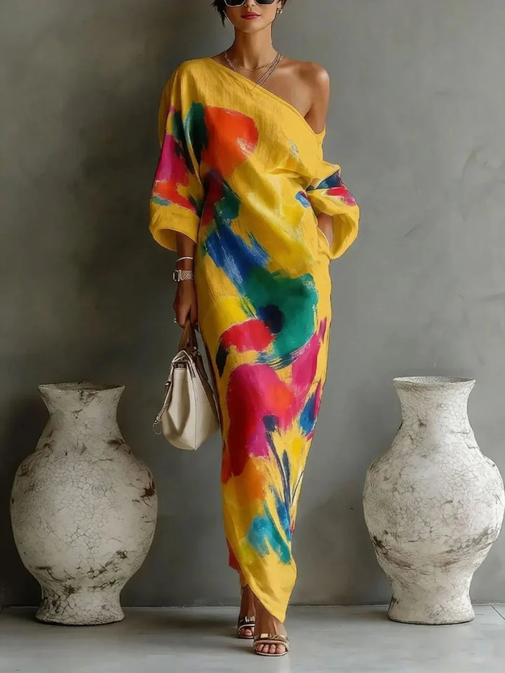 Full-length women's party wear, a one-shoulder flowy maxi dress in a striking abstract design. Ideal for summer.