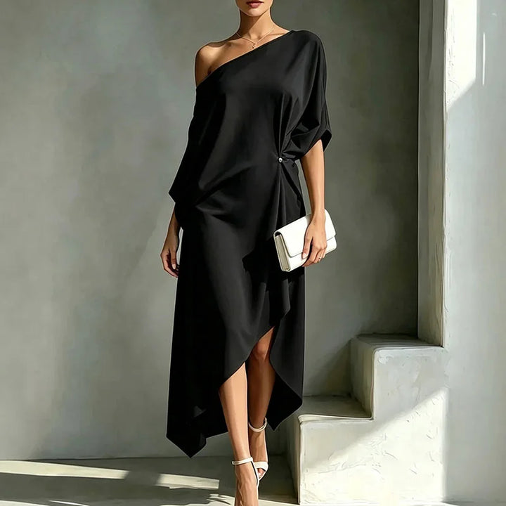 Stylish women's asymmetric draped loose long dress, ideal for comfortable summer fashion or chic autumn style.