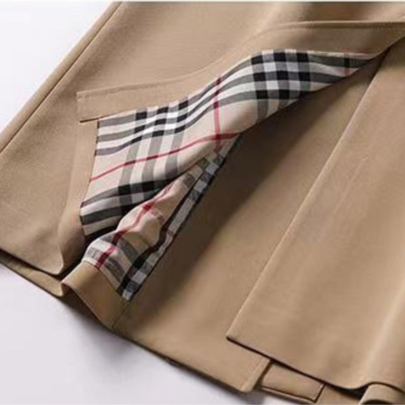 Durable and stylish women's belted trench, a classic long coat designed for timeless fall & winter wear.