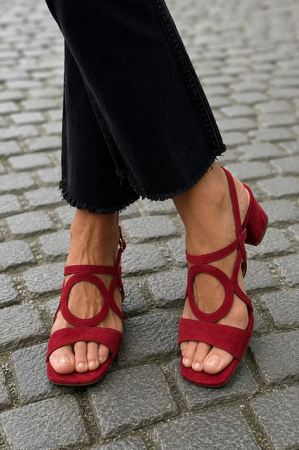 Women's elegant black block heel sandals with sculptural ankle detail & square toe, perfect for summer fashion.