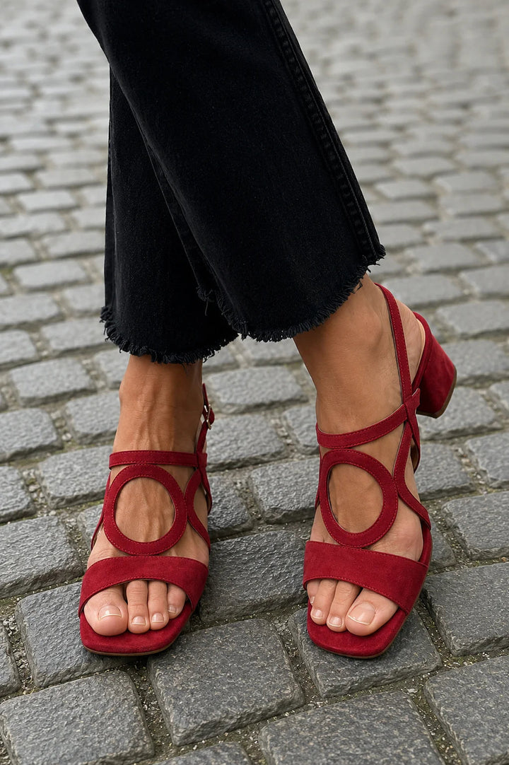 Women's elegant black block heel sandals with sculptural ankle detail & square toe, perfect for summer fashion.