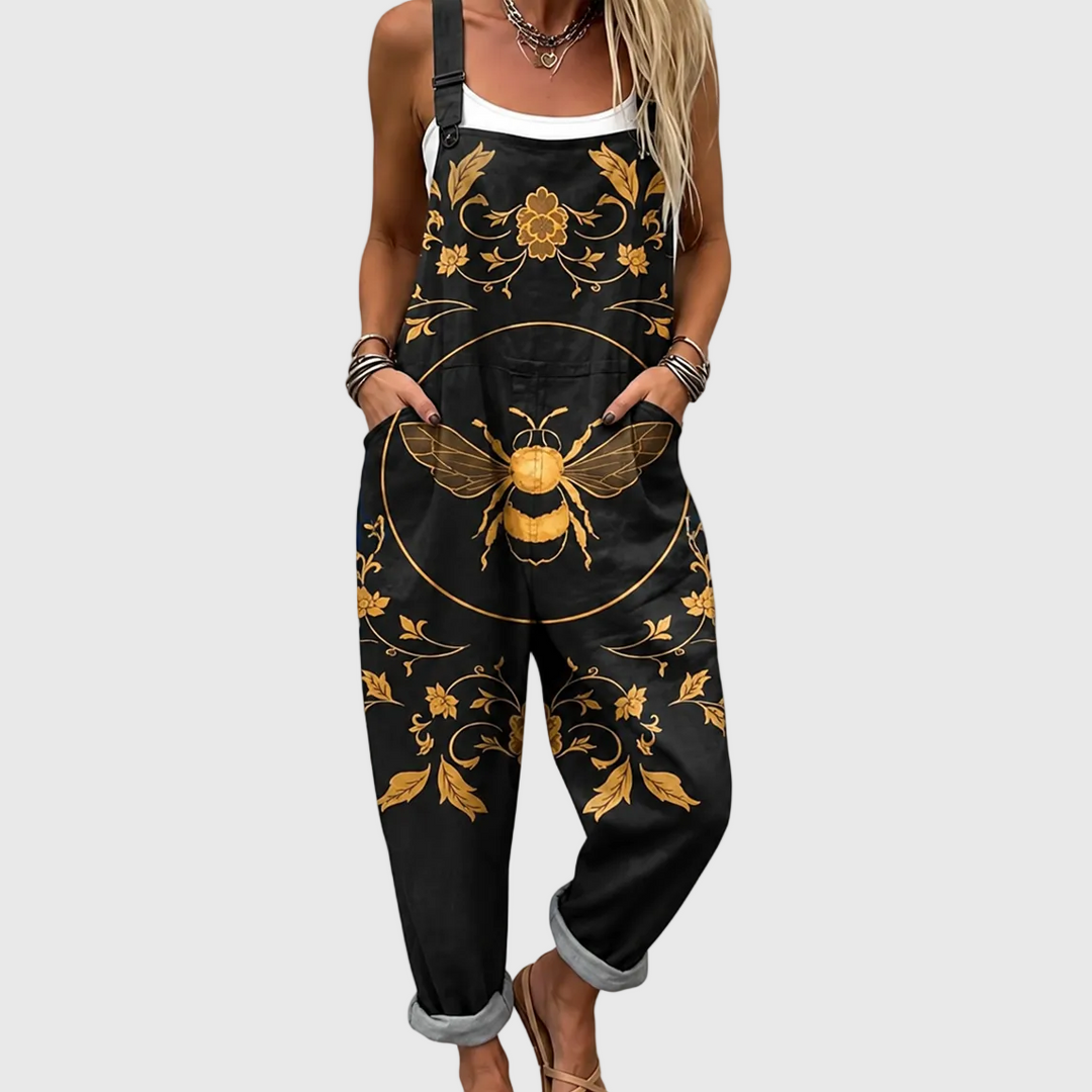 Women's elegant black jumpsuit with unique golden bee motif. Relaxed fit overalls for stylish spring/summer fashion.