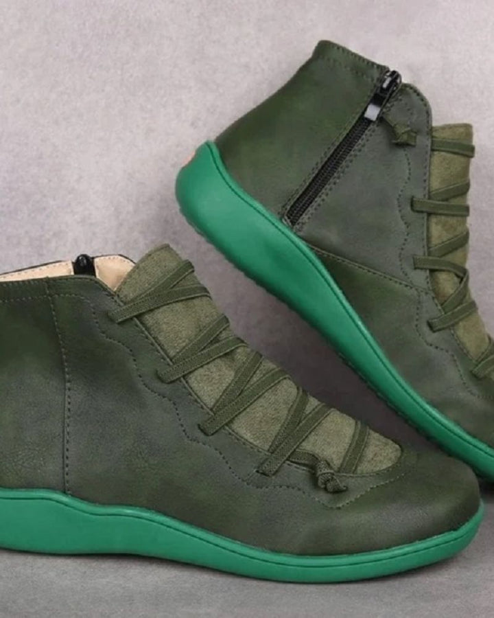 Woman wearing stylish leather ankle boots for comfortable everyday wear.