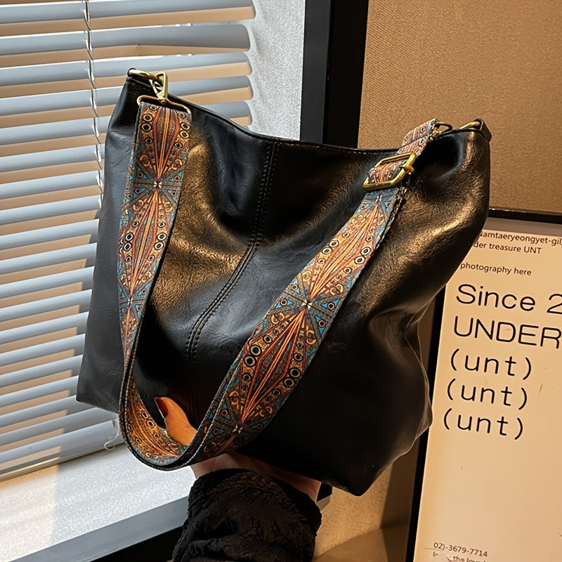 Spacious and chic leather handbag for women, perfect as a stylish shoulder bag.