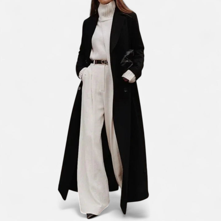 Classic women's black maxi coat, featuring a sleek tailored design for an elegant, versatile autumn/winter look.