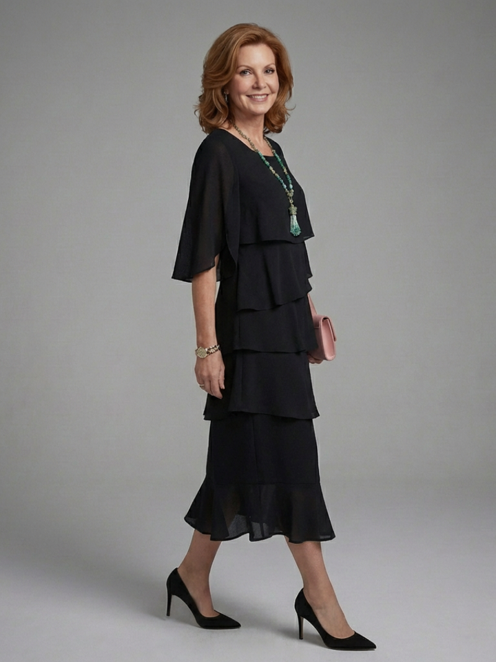 Relaxed fit women's black midi dress, featuring elegant layered cape sleeves for sophisticated casual or party wear.