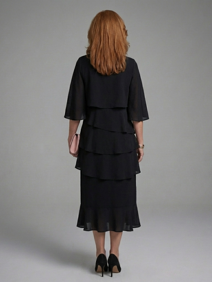 Stylish women's black midi dress with a flowing layered cape sleeve design, offering an elegant & sophisticated look.