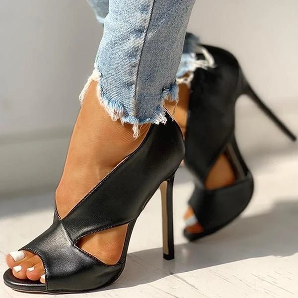Chic black open-toe stiletto heels for women with intricate cutout design. Elegant party & dress footwear.