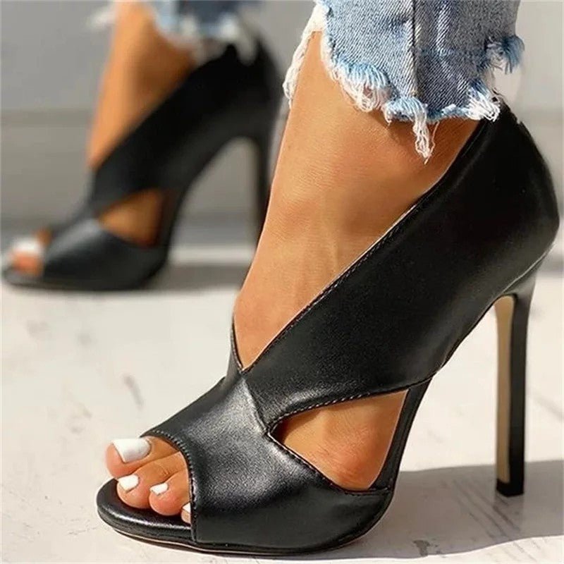 Stylish brown women's open-toe stiletto heels featuring a unique cutout design. Perfect for elegant events.