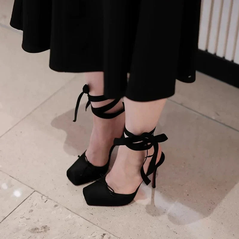 Black platform ankle strap court shoes for women, offering chic style for party heels & elegant evening wear.
