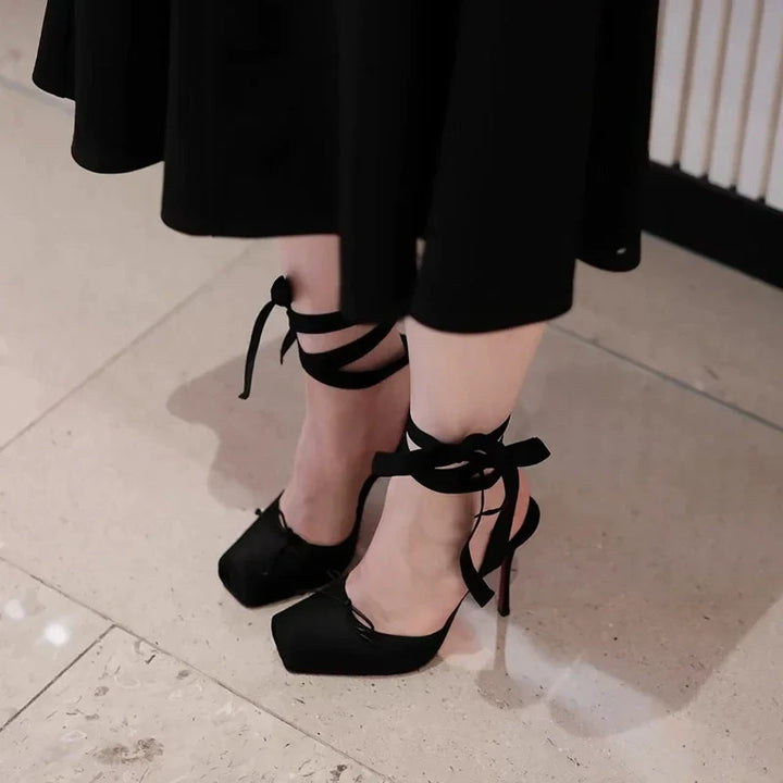 Black platform ankle strap court shoes for women, offering chic style for party heels & elegant evening wear.