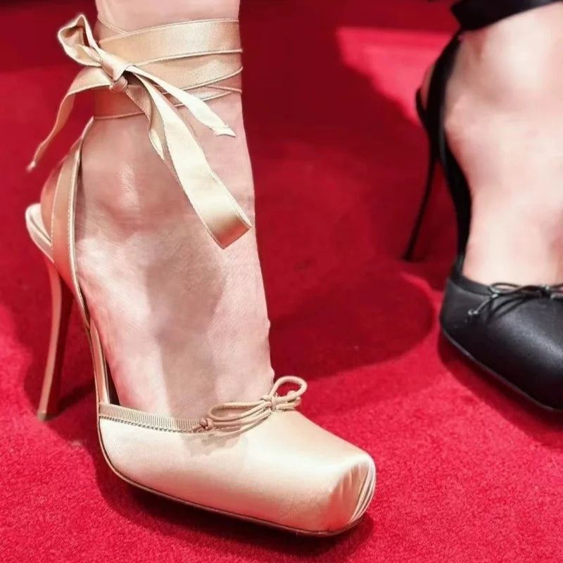 Elegant women's platform court shoes with a sleek ankle strap, essential footwear for weddings and dressy events.