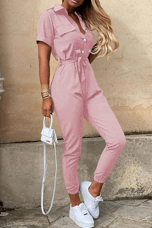 Flowy women's belted jumpsuit with a sophisticated shawl collar, perfect for special occasions.