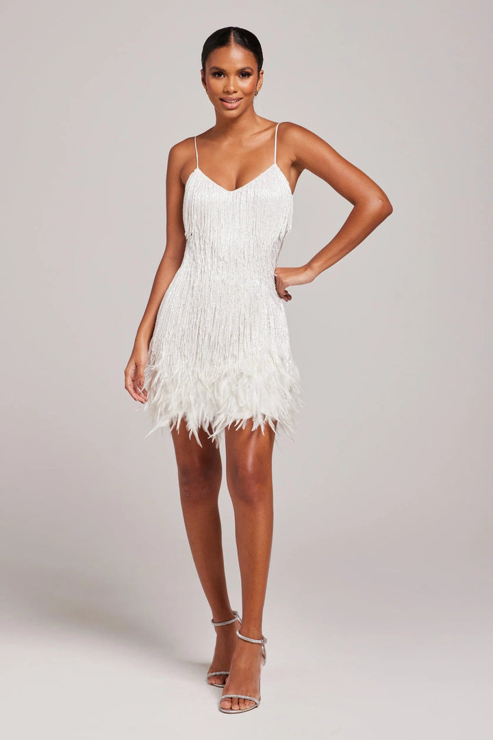 Women's elegant black sleeveless cocktail dress with stylish fringe detailing for special occasions.