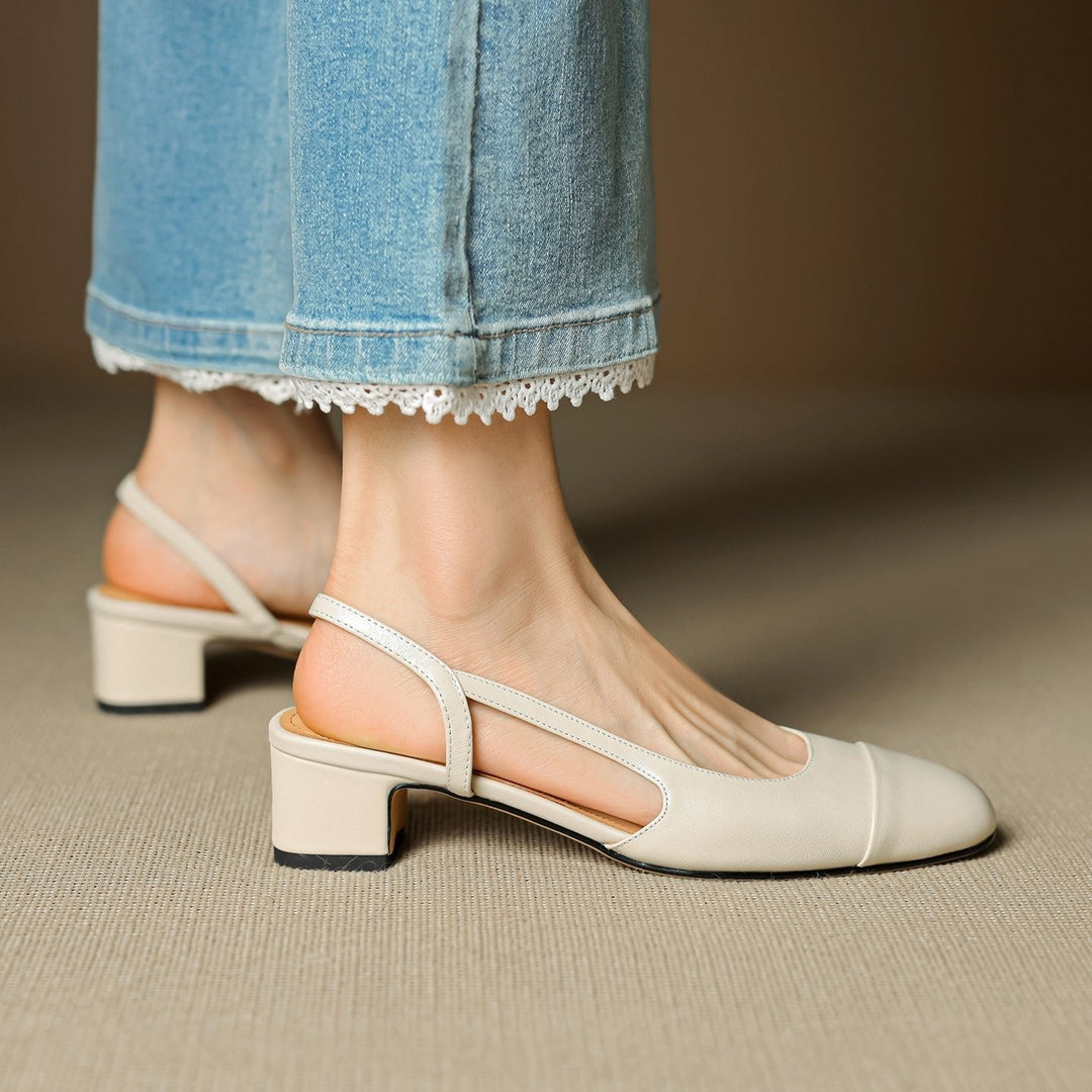 Black slingback block heel pumps for women, offering classic style and comfortable support.