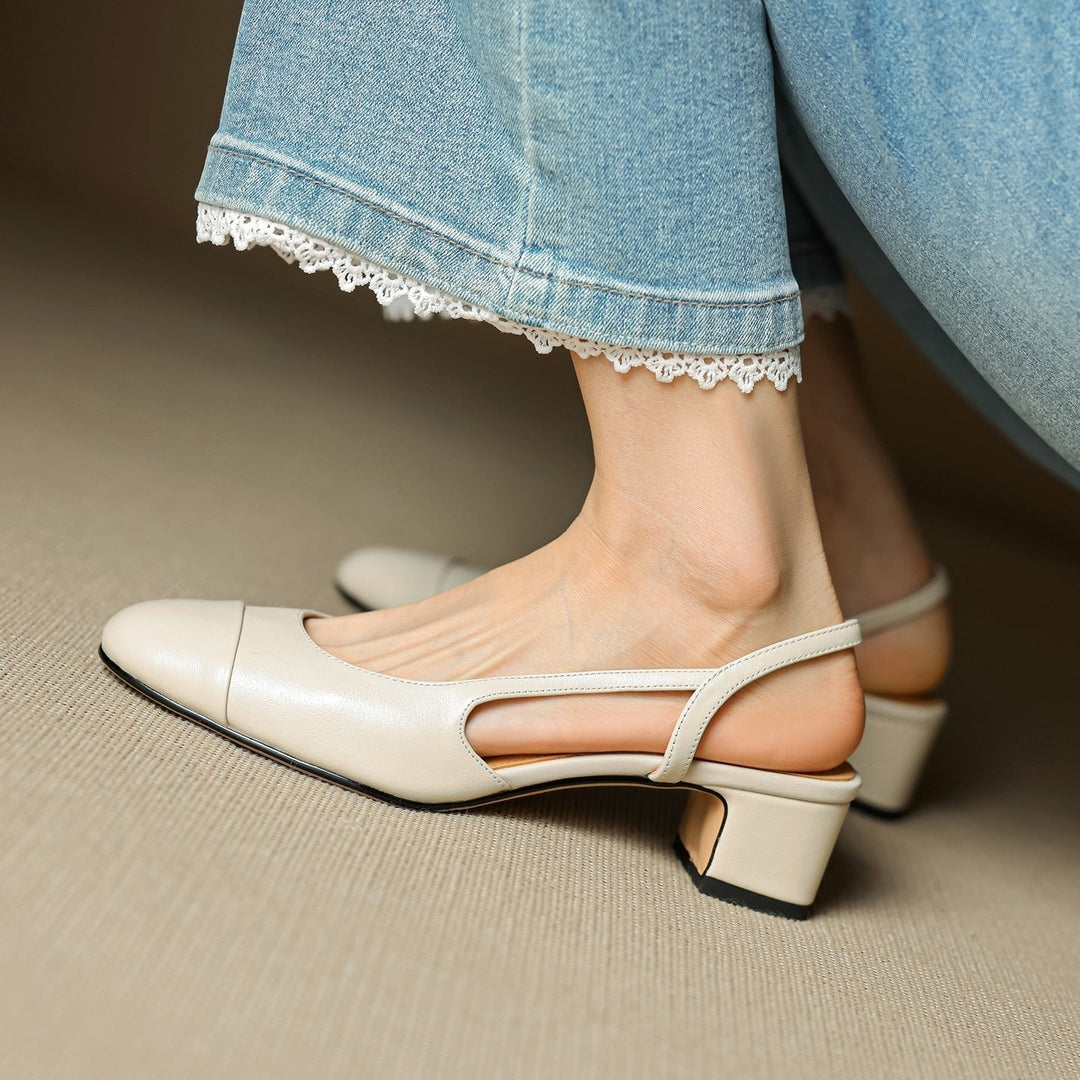 Professional women's black slingback block heel pumps, ideal office wear for modern women.