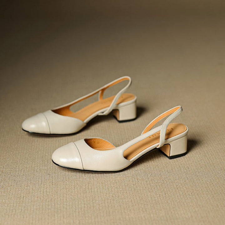 Chic women's black almond toe slingback pumps with a sturdy block heel, great for any occasion.