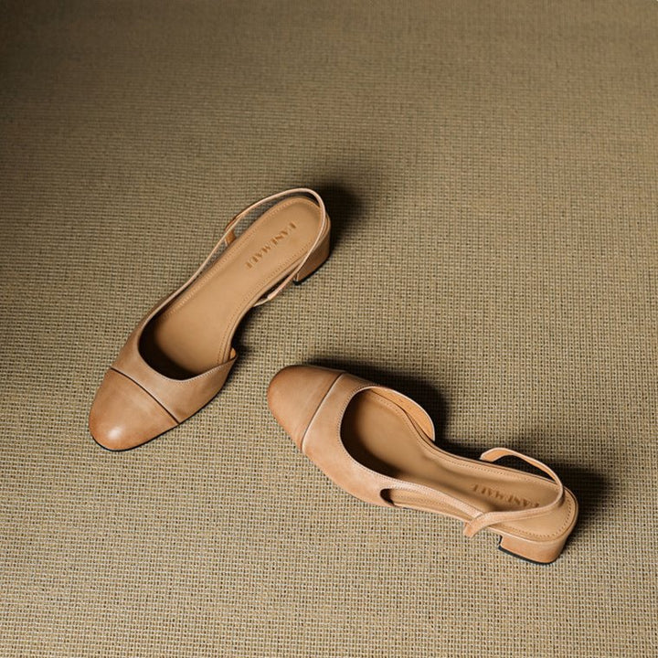 Sleek black slingback pumps for women featuring a stable block heel & elegant almond toe.