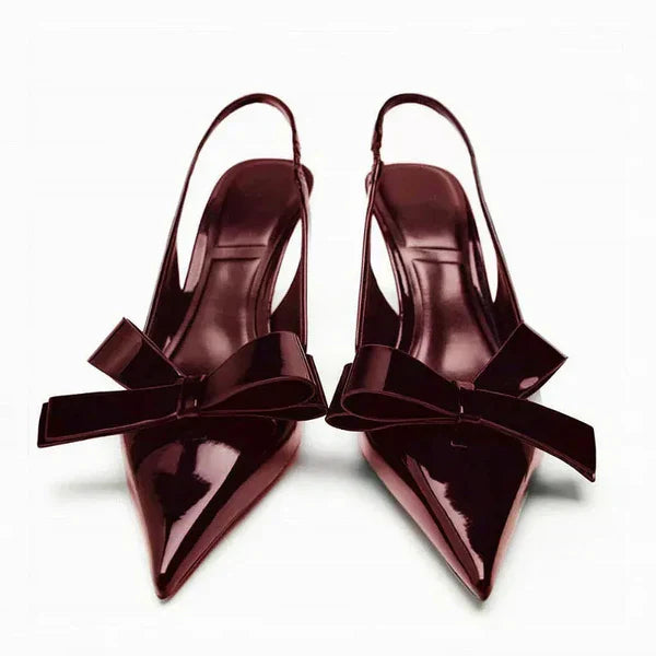 Women's elegant black slingback pointed toe heels with a chic bow detail