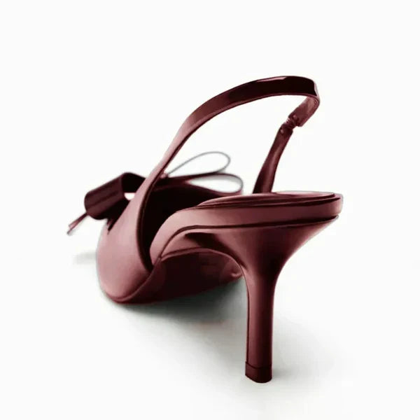 View of the side of women's formal shoes, highlighting the slingback strap and pointed toe