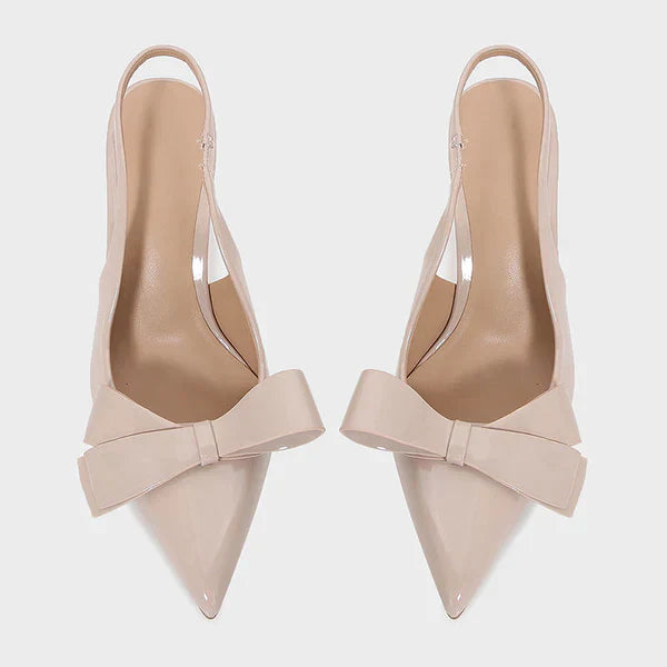 Detailed shot of a women's fashion heel with a classic pointed toe and feminine bow accent