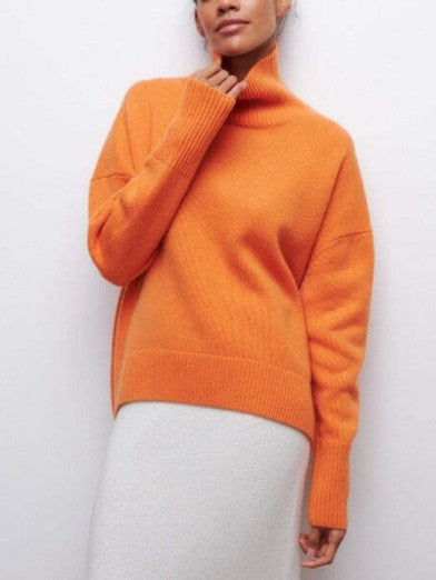 Elegant black women's long sleeve turtleneck. Comfortable, warm sweater, ideal for versatile winter fashion.