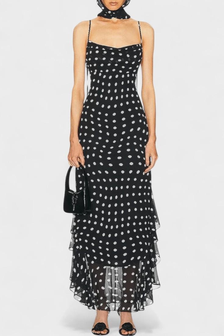 Women's elegant black & white polka dot dress with adjustable spaghetti straps, perfect for summer parties.