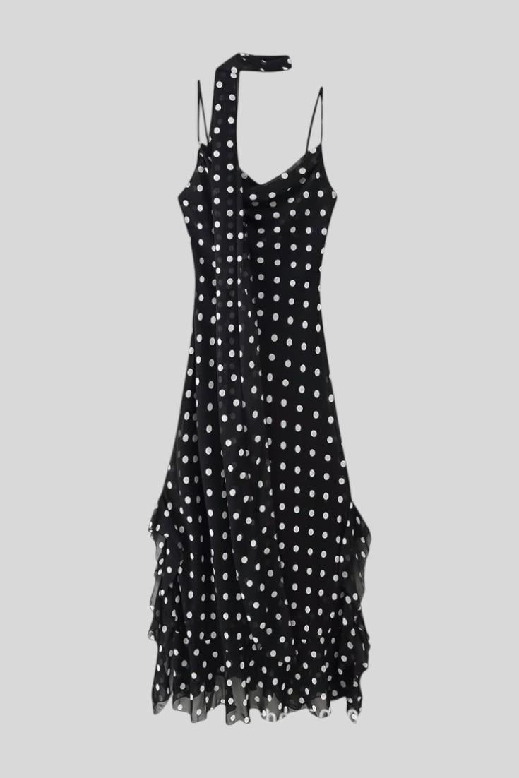 Romantic women's flowy polka dot summer dress. Adjustable straps for a casual chic or party look.